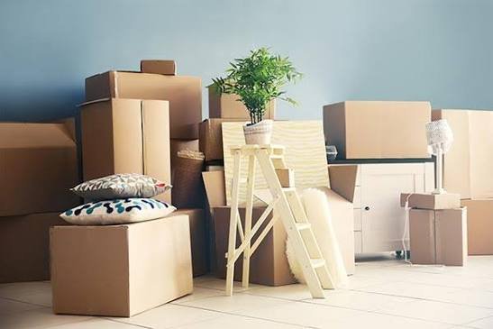 Gati packers wrapping furniture in a Bangalore apartment